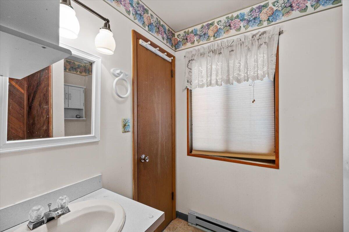 117 Manchester Drive Bushkill, PA 18324 - Photo 22 of 33 a bathroom with a sink and a mirror