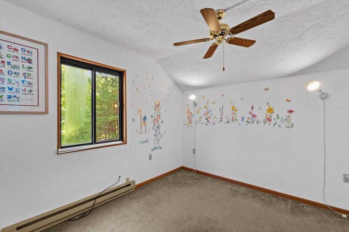 117 Manchester Drive Bushkill, PA 18324 - Photo 30 of 33 a view of a livingroom with a window and a ceiling fan
