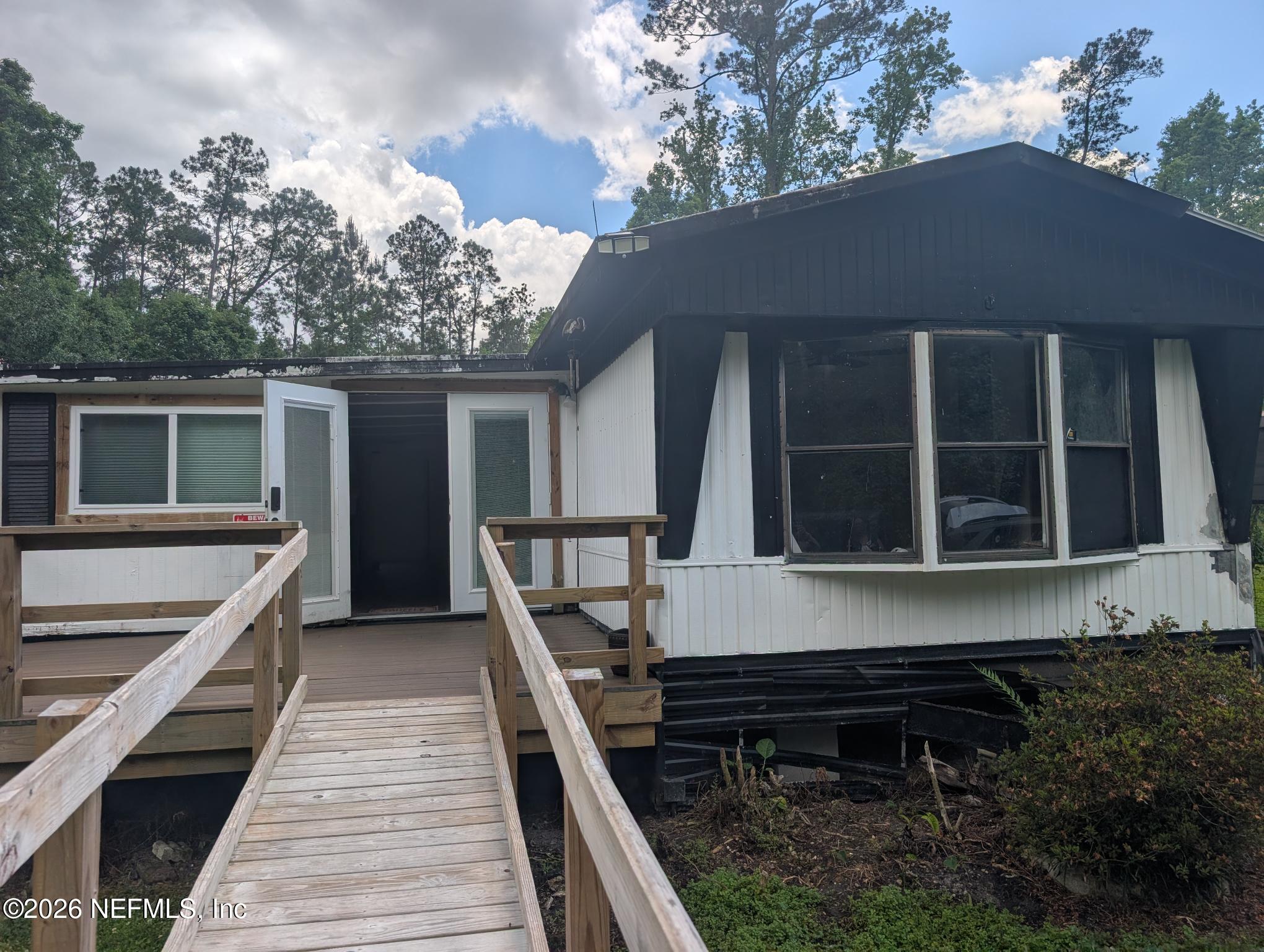 1950 Van Sickle Road Jacksonville, FL 32218 - Photo 1 of 1 a view of a house with a porch