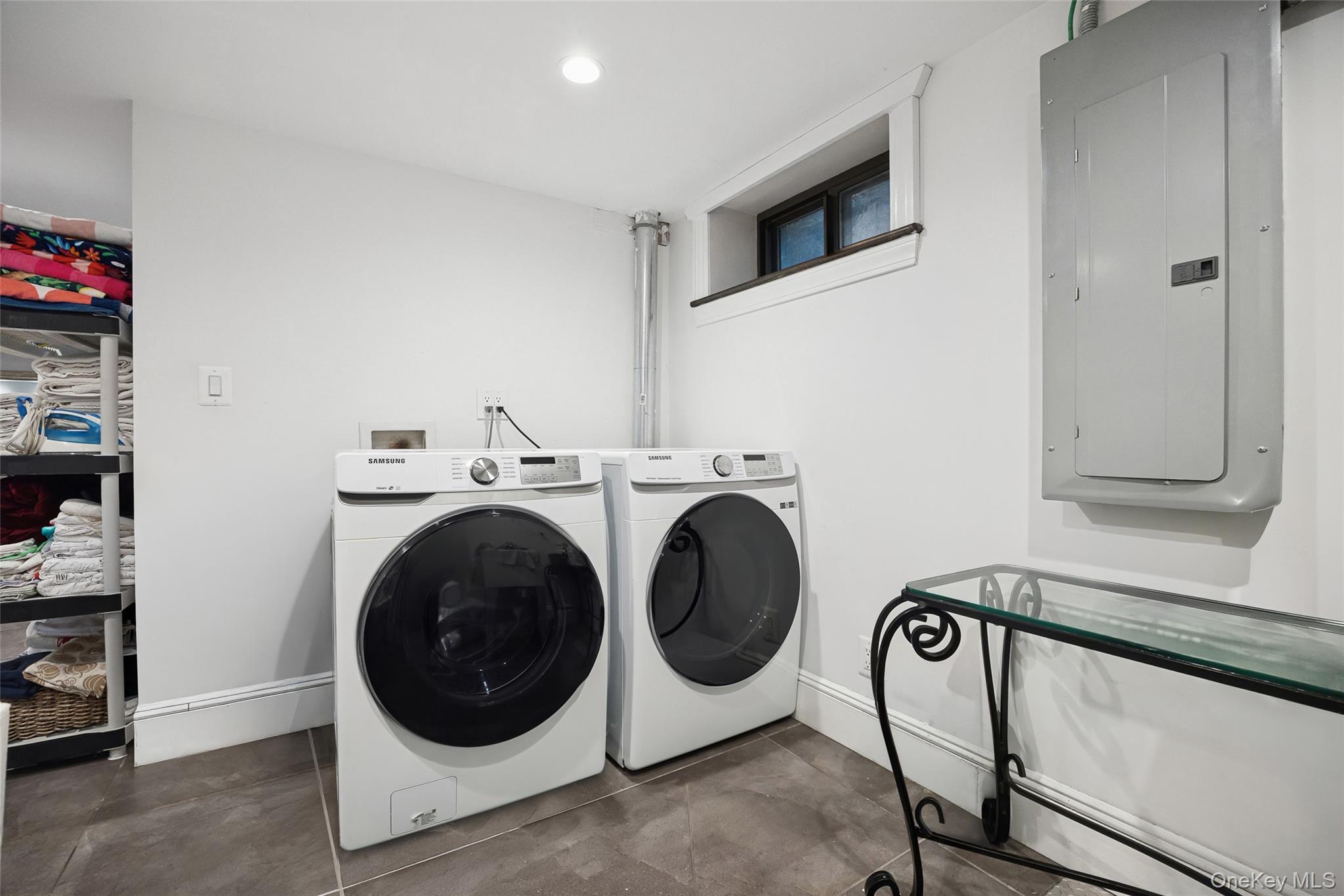 216 Beverly Road Queens, NY 11363 - Photo 38 of 50 a utility room with dryer and washer