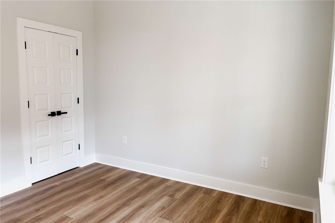 2515 Highway 29 Anderson, SC 29621 - Photo 28 of 38 Versatile room with durable wood flooring and crisp white trim, ready for personalization.