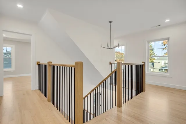 a view of a hallway with windows