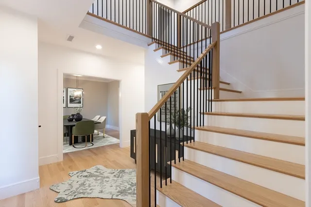 a view of entryway livingroom and hall with wooden floor