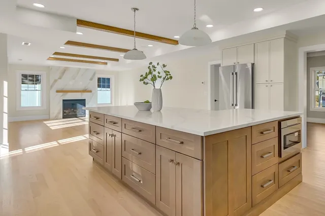 a spacious bathroom with a double vanity sink a large mirror a bathtub and a shower