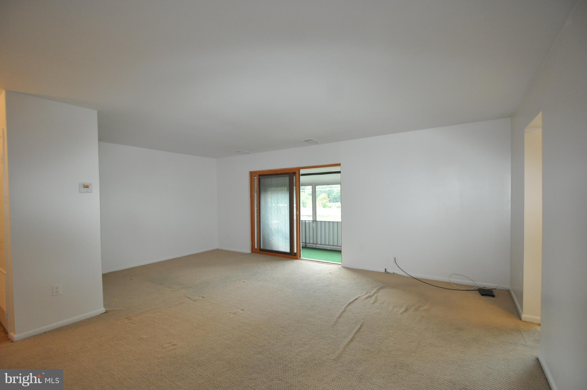 3350 Hewitt Avenue, Unit 302 Silver Spring, MD 20906 - Photo 7 of 12 LIVING ROOM WALKS OUT TO PORCH