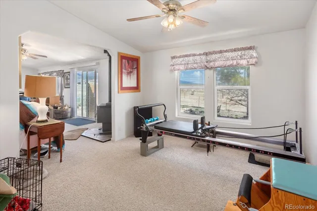 a bedroom with a bed and dresser