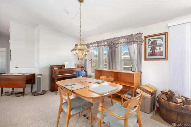 a living room with furniture a lamp and a fireplace