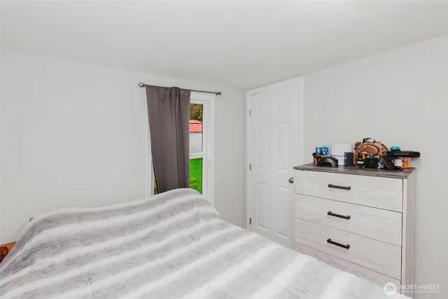 a bedroom with a bed and cabinets