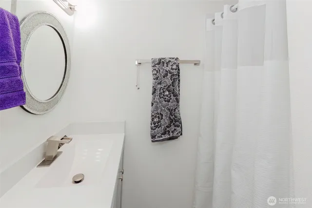 a bathroom with a bathtub and a sink