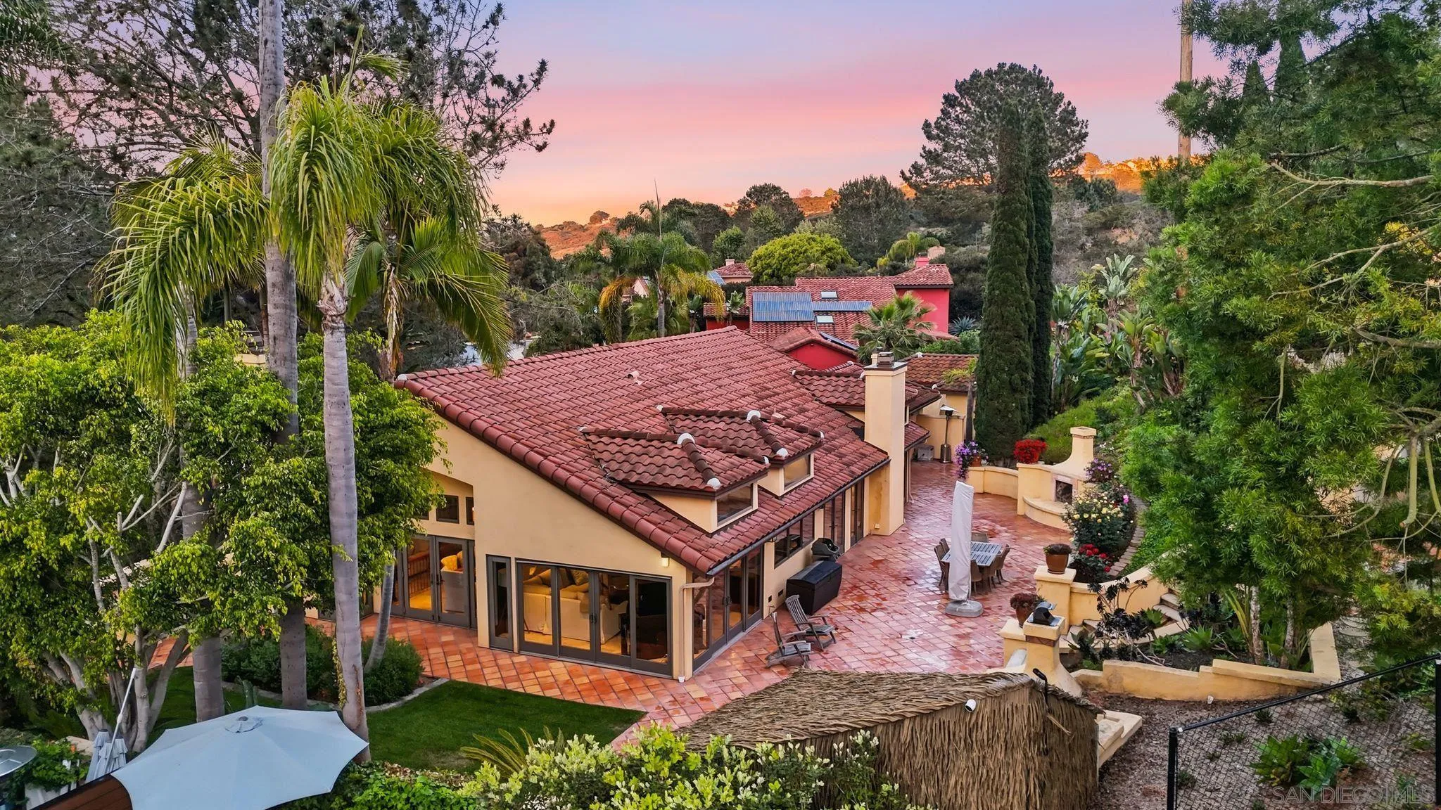 2969 Racetrack View Drive Del Mar, CA 92014 - Photo 4 of 59 an aerial view of a house with swimming pool and trees in the background