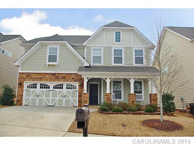 2005 Fallondale Road, Unit 921 Waxhaw, NC 28173 - Photo 1 of 16 a front view of a house with a yard