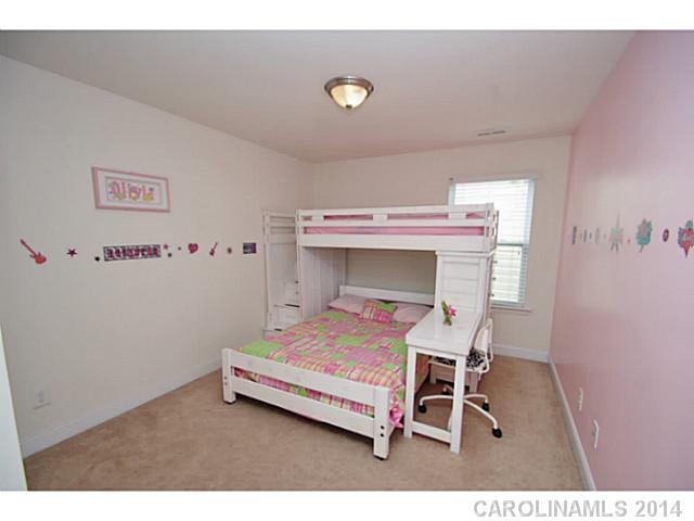 2005 Fallondale Road, Unit 921 Waxhaw, NC 28173 - Photo 11 of 16 a bedroom with a bed and a desk
