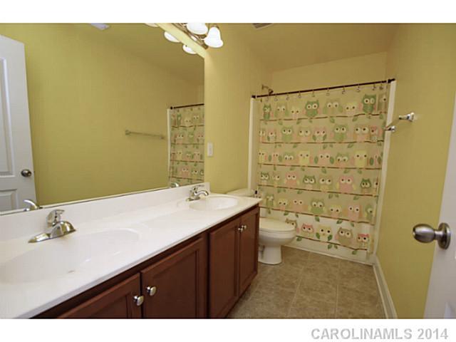 2005 Fallondale Road, Unit 921 Waxhaw, NC 28173 - Photo 13 of 16 a bathroom with a sink and a mirror