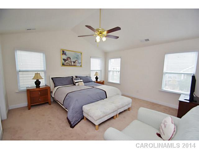 2005 Fallondale Road, Unit 921 Waxhaw, NC 28173 - Photo 7 of 16 a bedroom with a bed couches and window