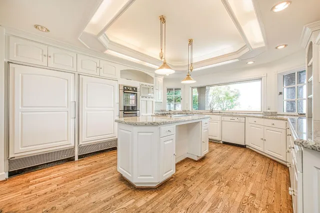 a bedroom with furniture and a fireplace