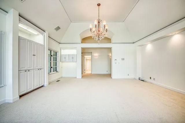 a view of a swimming pool with an outdoor seating