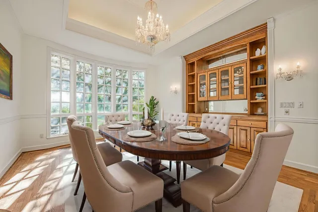 a view of an empty room with a chandelier