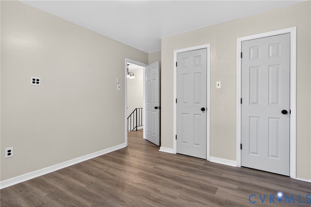 10050 Purcell Road Richmond, VA 23228 - Photo 21 of 26 a view of an empty room with wooden floor