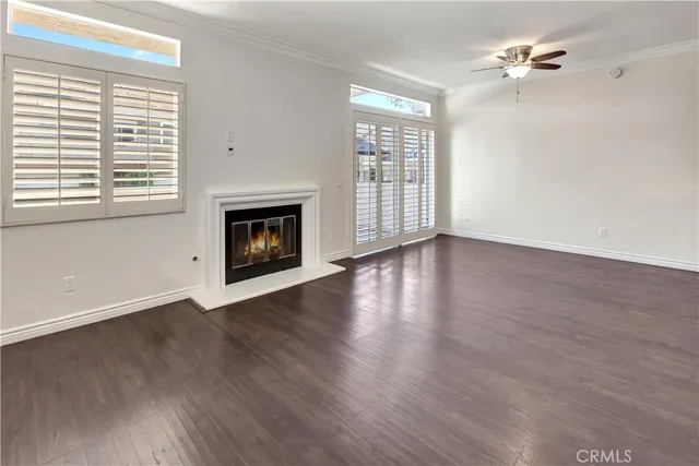 a view of a kitchen with wooden floor and a sink