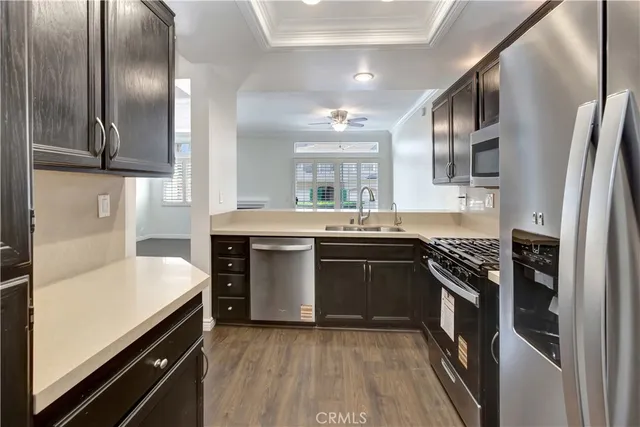 a kitchen with a sink and a refrigerator