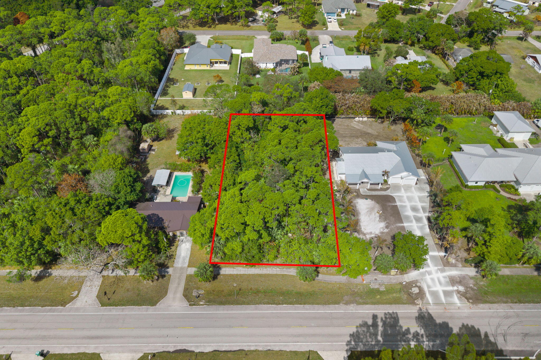 404 East Midway Road Fort Pierce, FL 34982 - Photo 1 of 11 an aerial view of a house with a yard and garden