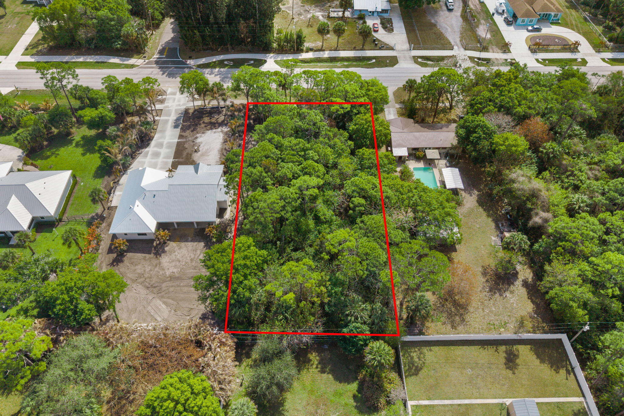 404 East Midway Road Fort Pierce, FL 34982 - Photo 3 of 11 an aerial view of a house with a yard and lake view