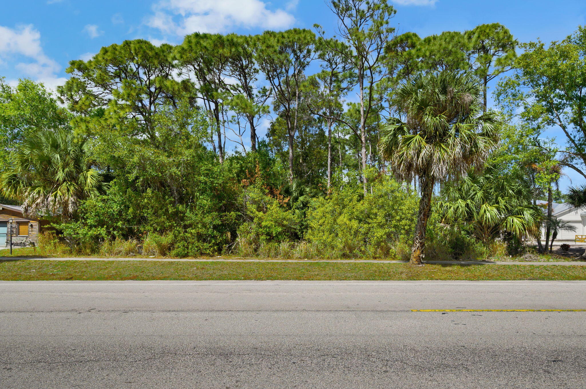 404 East Midway Road Fort Pierce, FL 34982 - Photo 9 of 11 a view of a garden with a pathway
