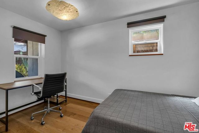 a bathroom with a sink toilet and mirror