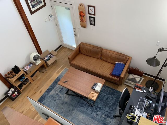 a view of a hallway with seating area