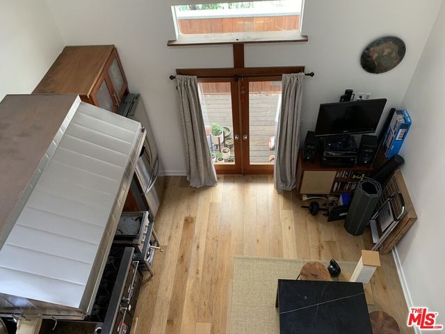 a kitchen with stainless steel appliances a stove a sink and a refrigerator