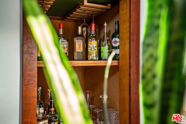 a living room with furniture a flat screen tv and a window