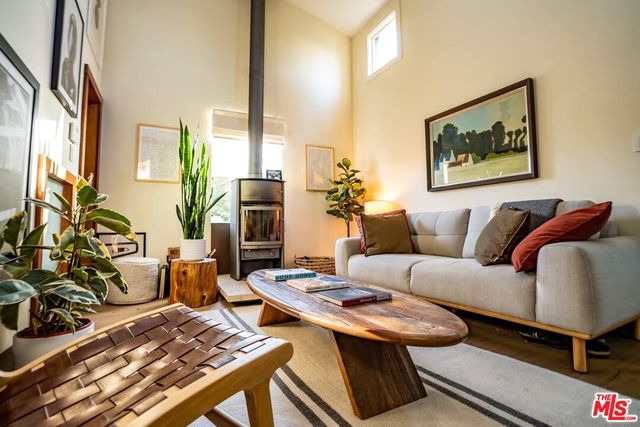 a kitchen with stainless steel appliances granite countertop a sink and a refrigerator