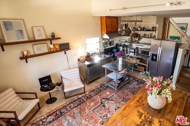 a room that has a fireplace and a shelf