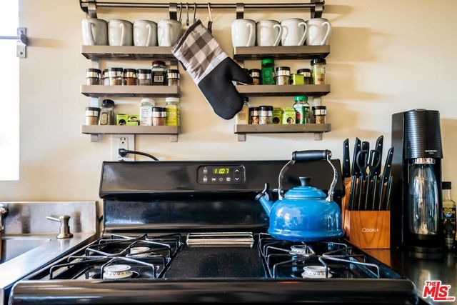 a bedroom with a bed and a large mirror