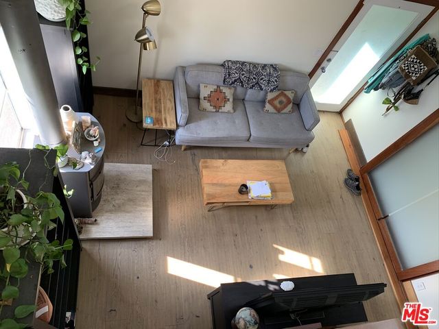 a view of a patio with table and chairs and potted plants