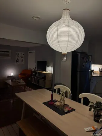 a room with two chairs and a chandelier