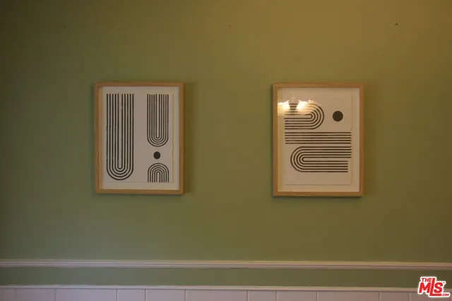 a bedroom with bed and a desk