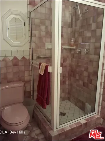 a bathroom with a toilet and a sink