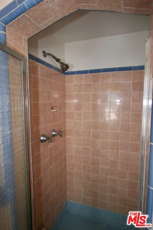 a view of a workspace with furniture and wooden floor
