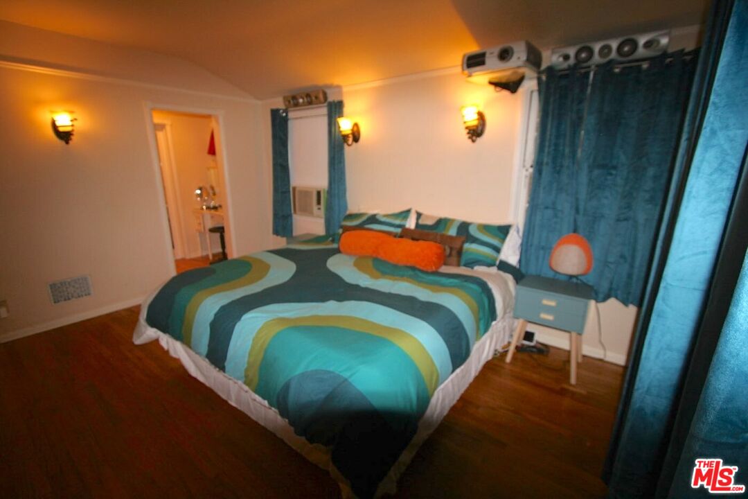 10317 Lauriston Avenue Los Angeles, CA 90025 - Photo 43 of 52 a bedroom with a bed and a mirror