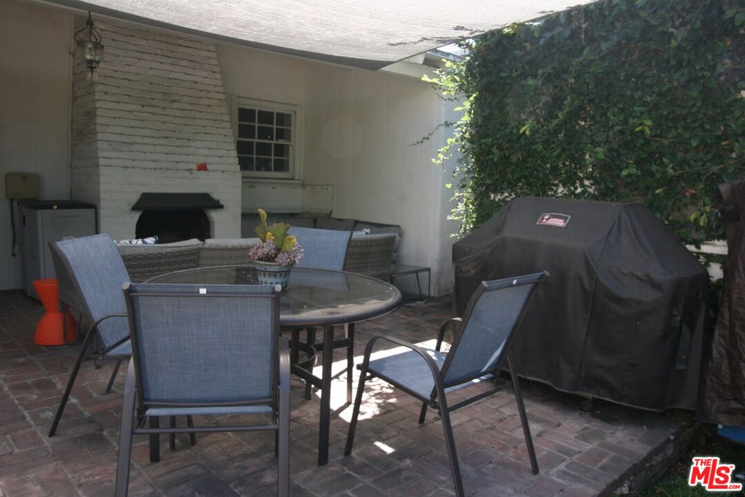 10317 Lauriston Avenue Los Angeles, CA 90025 - Photo 48 of 52 a backyard of a house with table and chairs