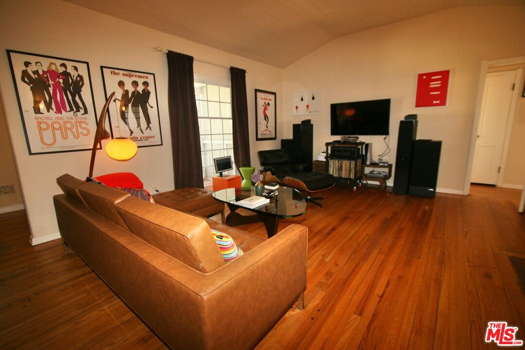 10317 Lauriston Avenue Los Angeles, CA 90025 - Photo 5 of 52 a living room with furniture fireplace and flat screen tv