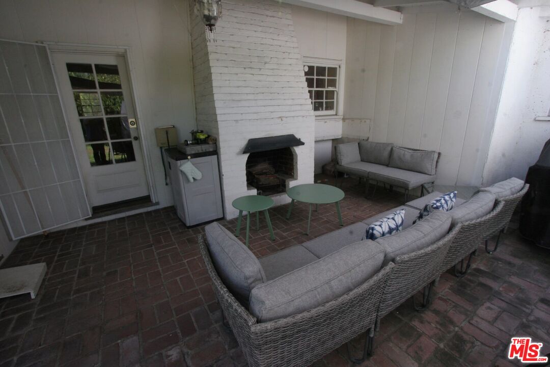 10317 Lauriston Avenue Los Angeles, CA 90025 - Photo 52 of 52 a living room with furniture and a fireplace