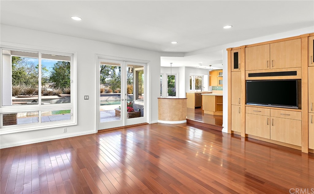 34 New Haven Laguna Niguel, CA 92677 - Photo 14 of 35 a view of an empty room with wooden floor and a kitchen