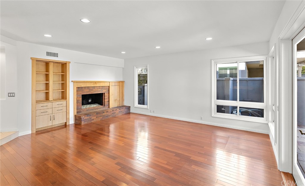 34 New Haven Laguna Niguel, CA 92677 - Photo 15 of 35 a view of an empty room with wooden floor fireplace and a window