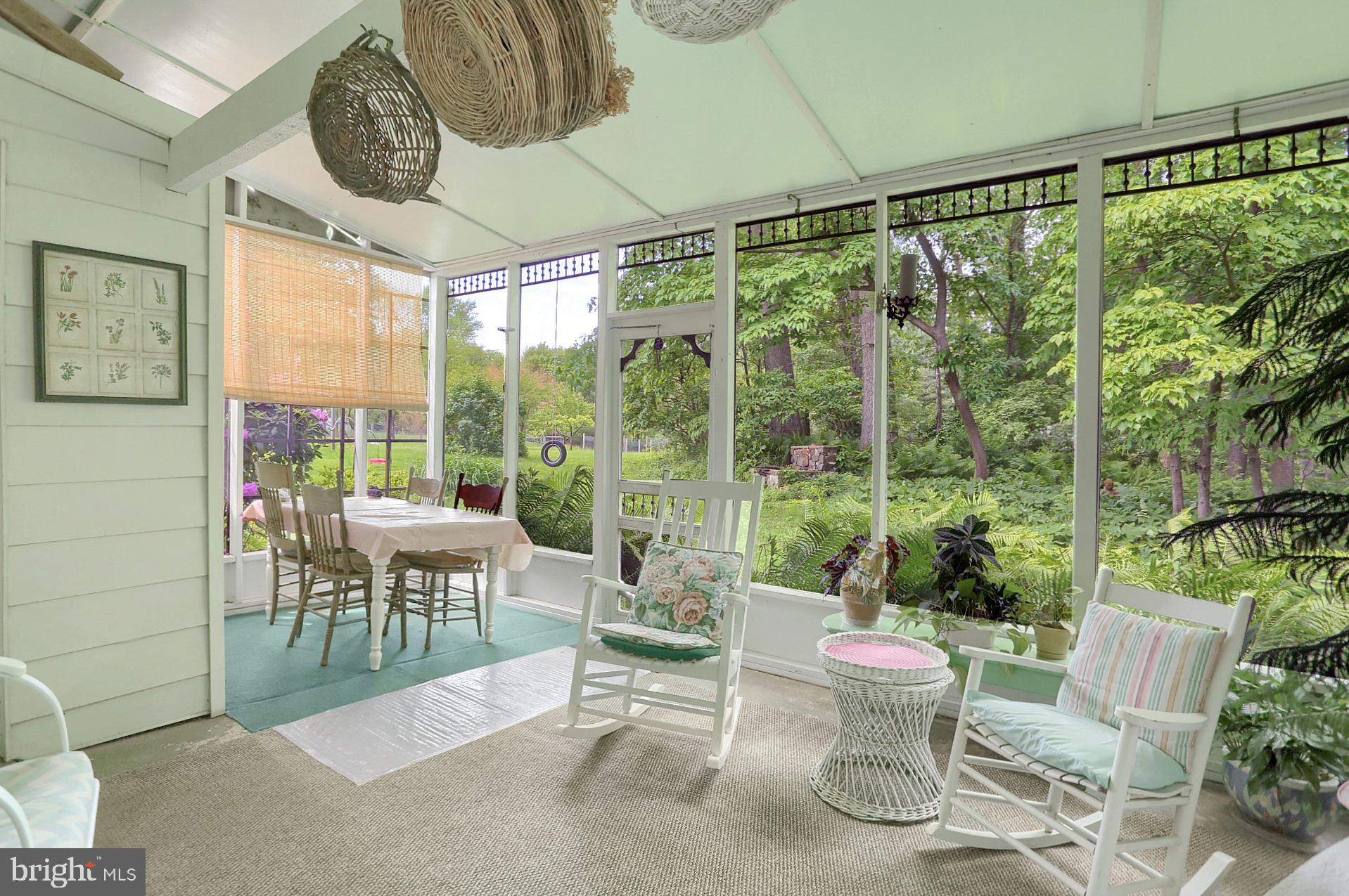 731 Vinemont Road Reinholds, PA 17569 - Photo 15 of 60 Back of home/screened in porch with eating area