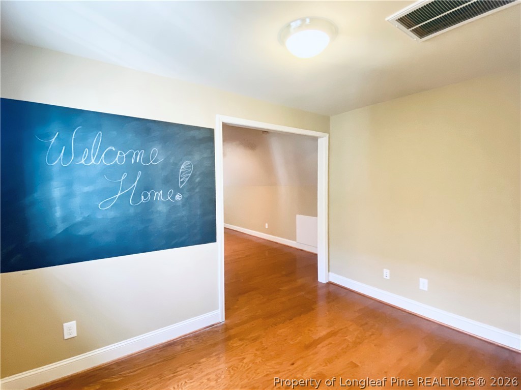 175 Pine Hawk Drive Spring Lake, NC 28390 - Photo 30 of 43 an empty room with wooden floor