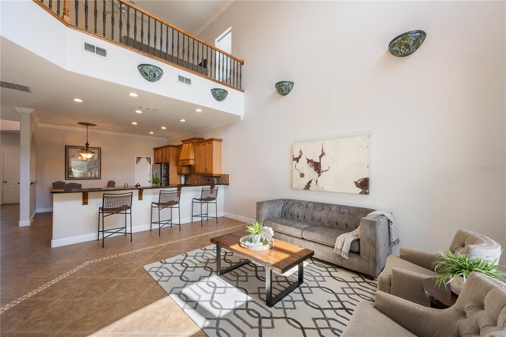 8119 Vía Rosa Orlando, FL 32836 - Photo 10 of 62 a living room with furniture and kitchen view with wooden floor