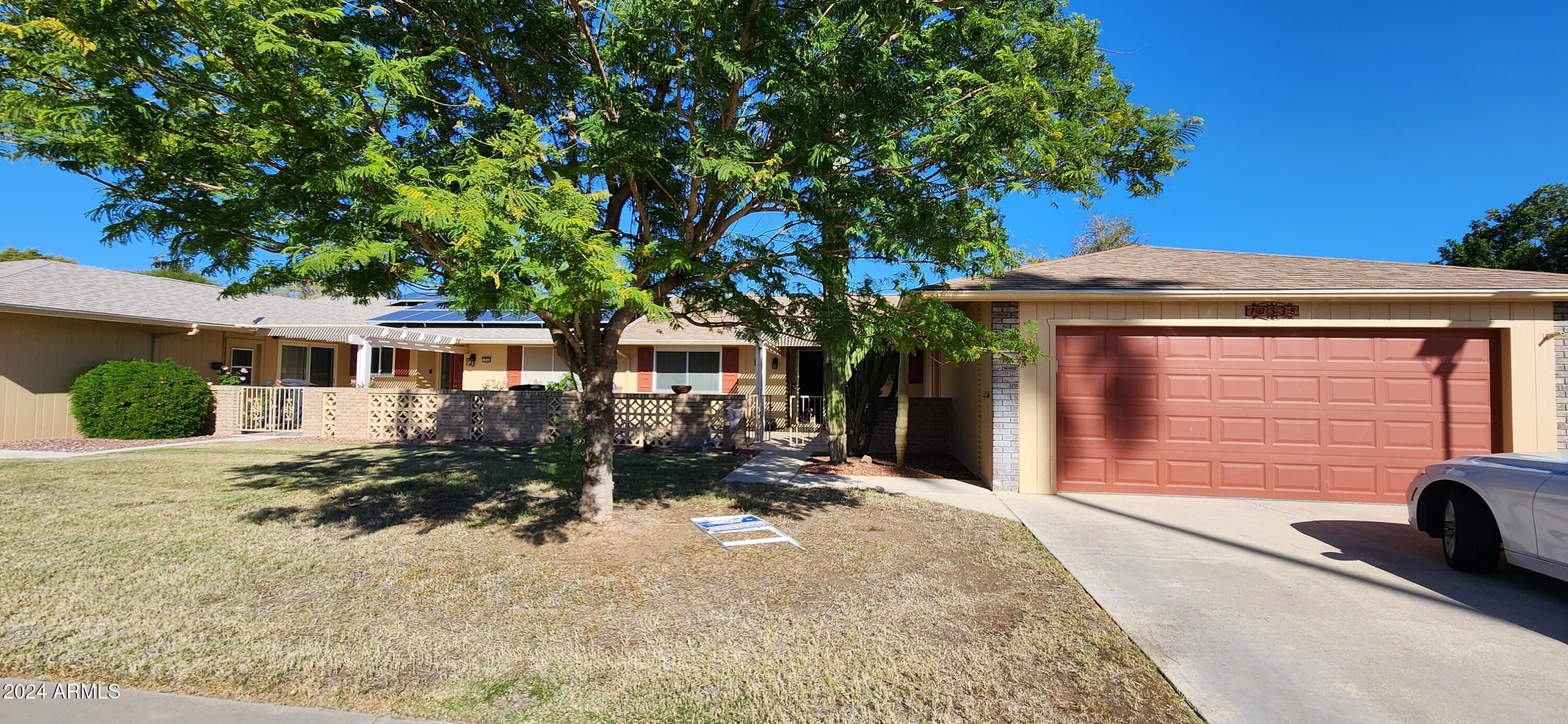 10338 West Kingswood Circle Sun City, AZ 85351 - Photo 1 of 24 front view of a house with a patio