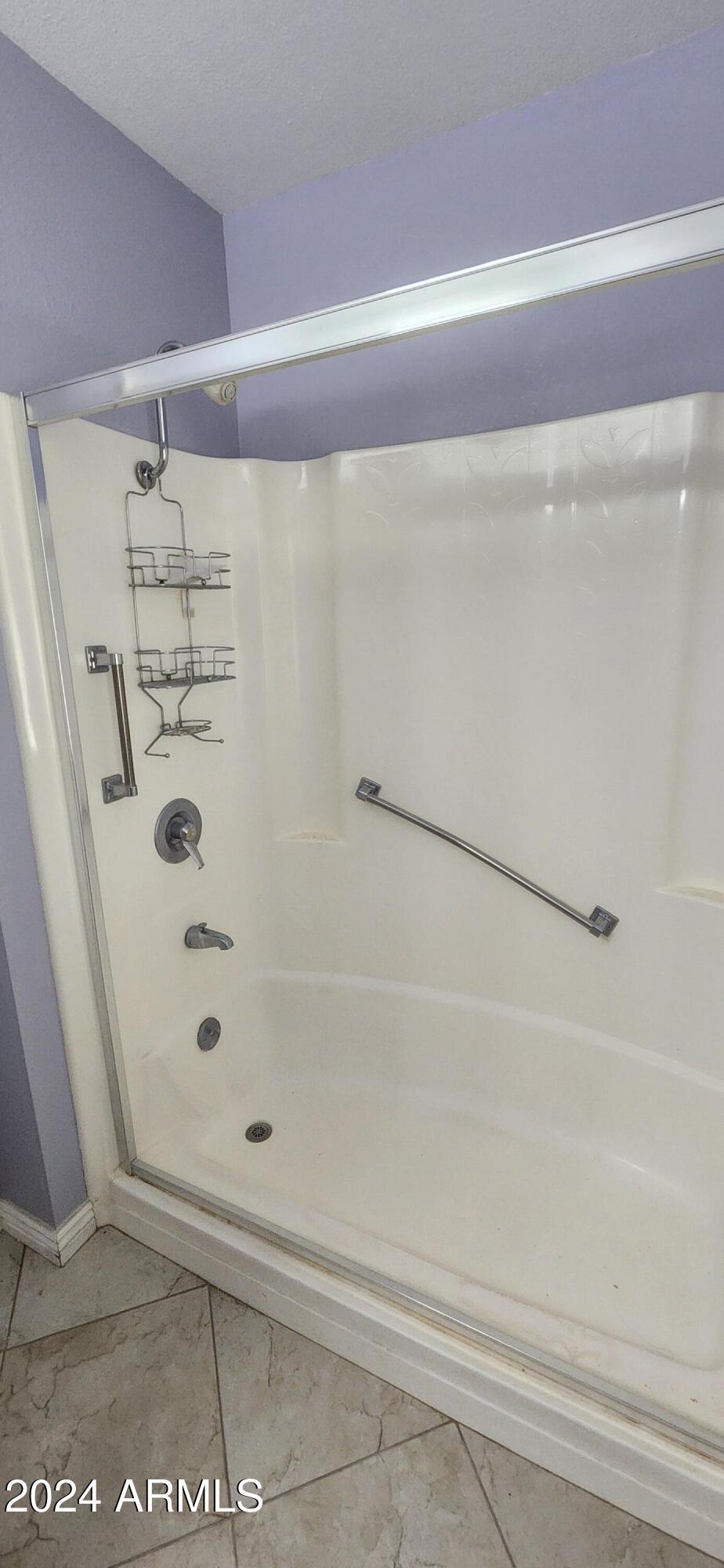 10338 West Kingswood Circle Sun City, AZ 85351 - Photo 17 of 24 a bathroom with a shower